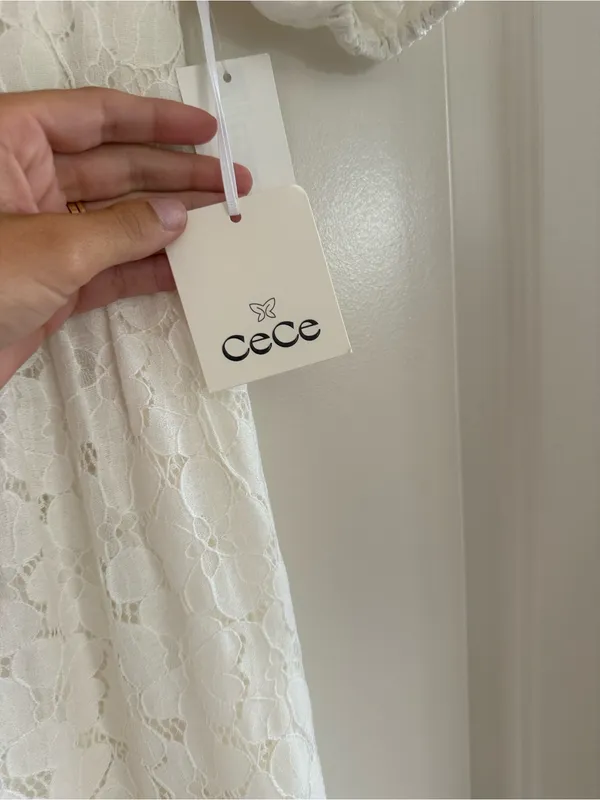 CeCe White Lace Tiered Mini Dress with Black Bow Details - Image 3