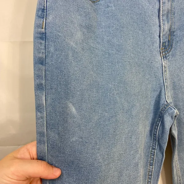 EUC Women’s medium/light wash‎ blue stretch flare leg distressed hem jeans XL - Image 5