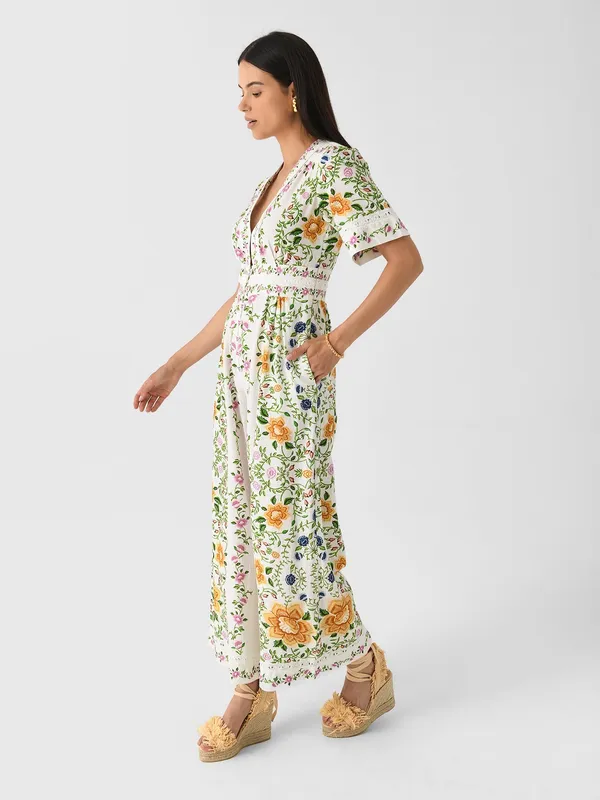 The Farm Rio Folk Floral Jumpsuit features a vibrant print with short sleeves, a V-neckline, and a relaxed, wide-leg silhouette. - Image 8