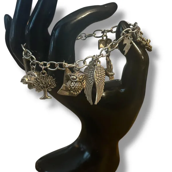 Silver tone charm bracelet with assorted charms - Image 2