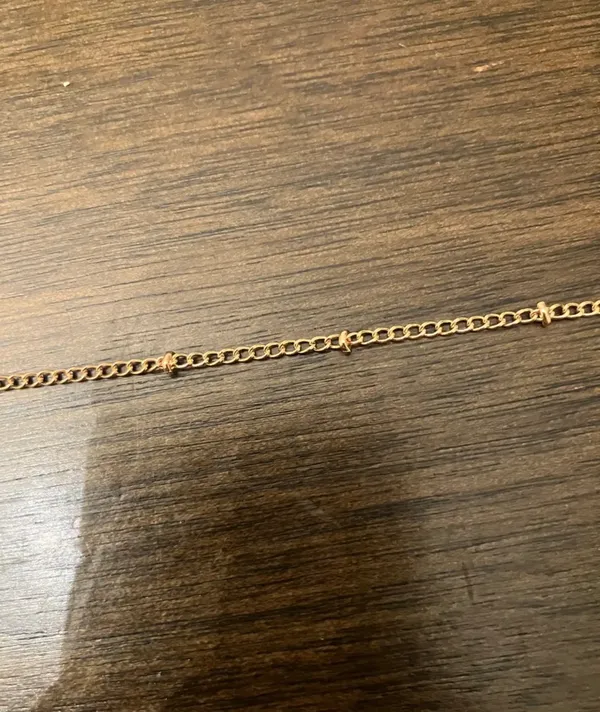 Delicate Satellite Gold Chain Bracelet with Knot Accents - Image 2