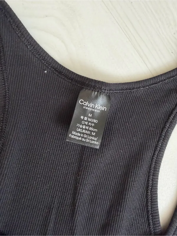 Calvin Klein Black Ribbed Racerback Tank with Silver cK Logo - Image 2