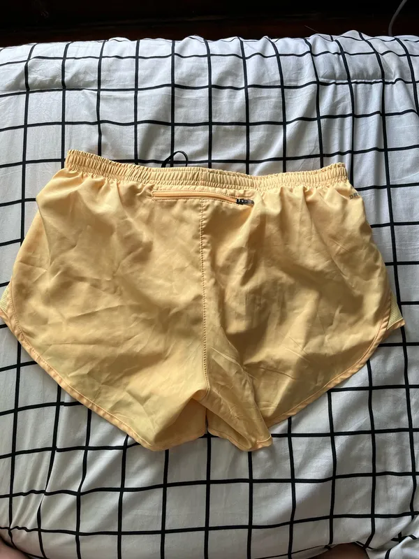 Size medium butter yellow nike running shorts - Image 2