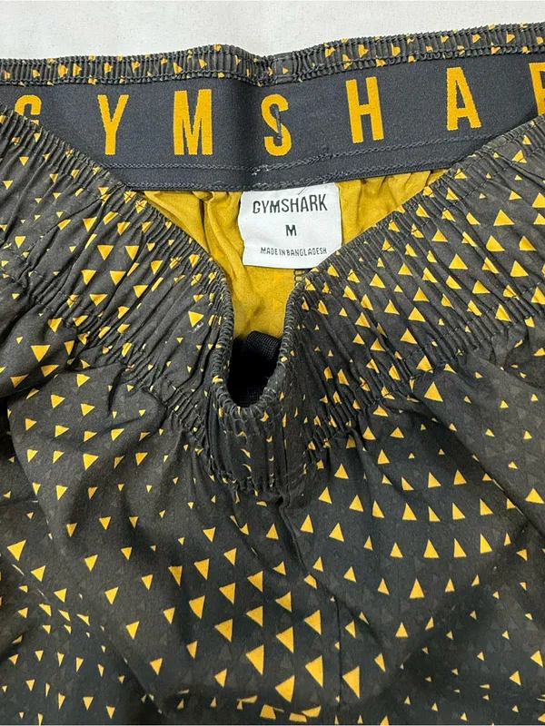 Gymshark Black Shorts with Gold Triangle Print - Image 4