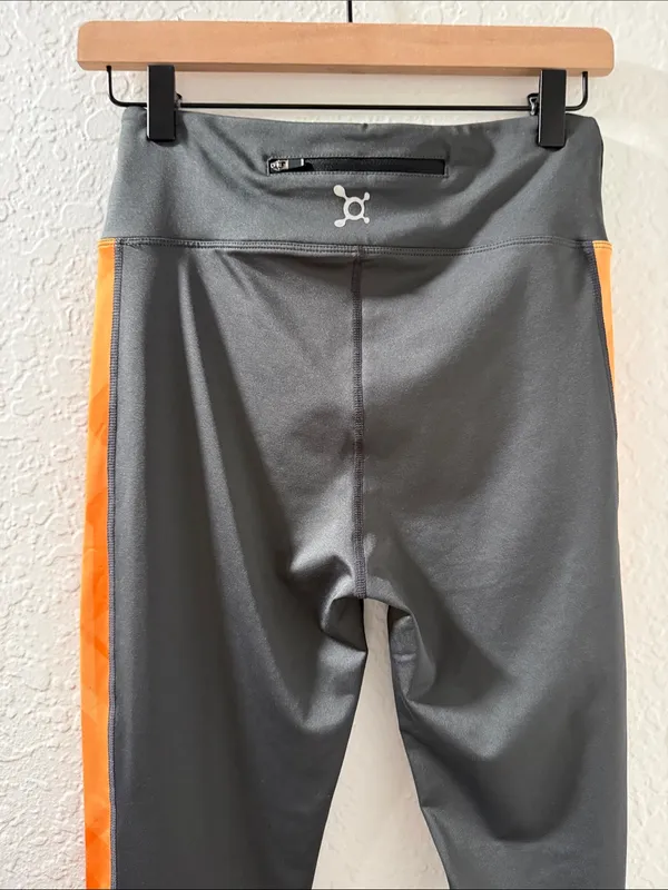 NWT OTF Orangetheory Fitness Gray Leggings with Orange Side Stripes - Image 3
