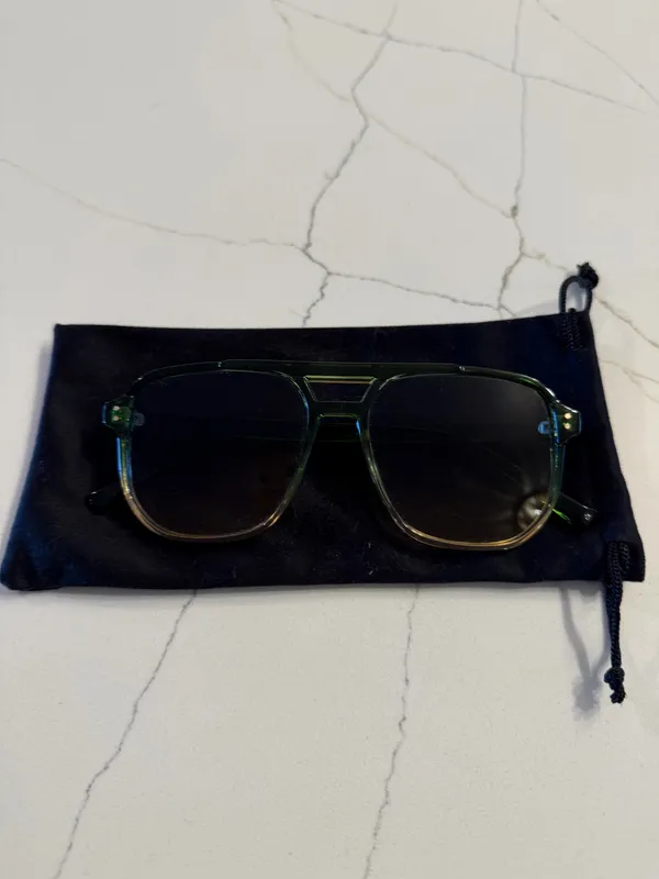 Unbranded Women's Aviator Sunglasses Like New Condition Description: Elevate your accessory collection with these stylish women's aviator-style sunglasses. Featuring translucent green frames and tint-gradient square aviator lenses, these frames offer a chic, modern retro look suitable for any season. Brand: Unbranded Size: One Size Fits Most Condition: Excellent, like-new condition with no scratches, marks, or visible flaws. Includes: Comes with a soft black drawstring protective pouch/case. Carefully packaged and ready to ship promptly! - Image 3