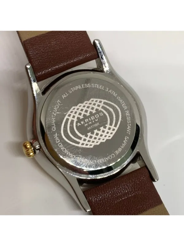 Akribos XXIV Diamond Dial Two Tone Date women Quartz Watch 34mm Sapphire running - Image 6