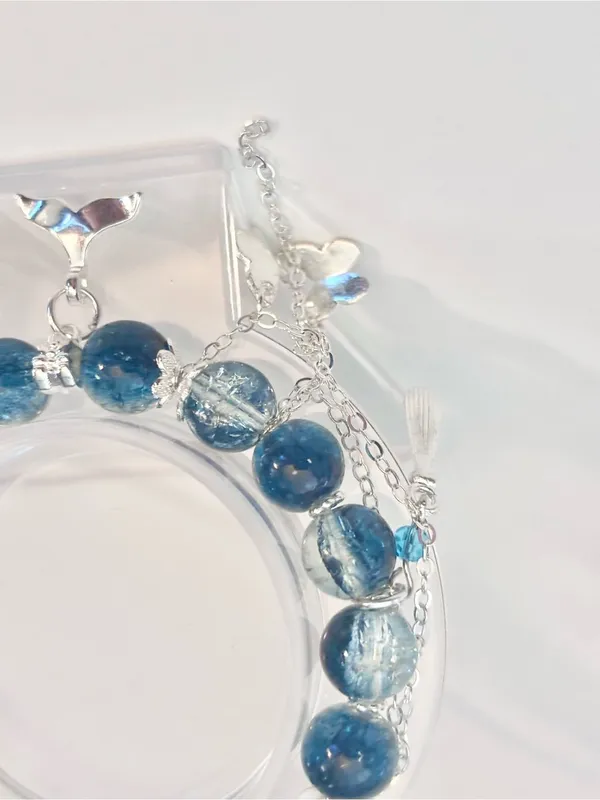 Hand Crafted Blue Beaded Charm Bracelet with Whale Tail And Butterfly Accents - Image 4