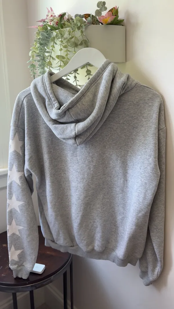 Gray Starfit hoodie with white star pattern on sleeves size medium - Image 5