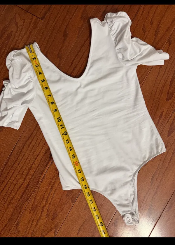 Vylette White bodysuit with Puffy Sleeves - Size Medium. ***refer to measurements. Super Cute top gentle worn and in excellent condition. Cotton/ spandex material. Measurements approximately for the bodysuit/ 14” from armpit to armpit x 25” from shoulder to snaps in crotch. Non-smoking home. Priced to sell at as is condition. Don’t like my price please make reasonable offer. - Image 7