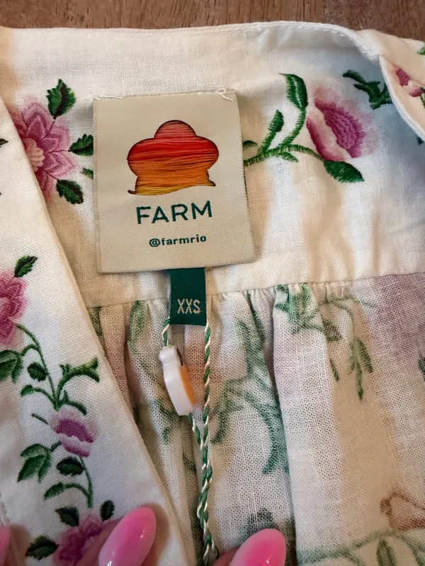 The Farm Rio Folk Floral Jumpsuit features a vibrant print with short sleeves, a V-neckline, and a relaxed, wide-leg silhouette. - Image 5
