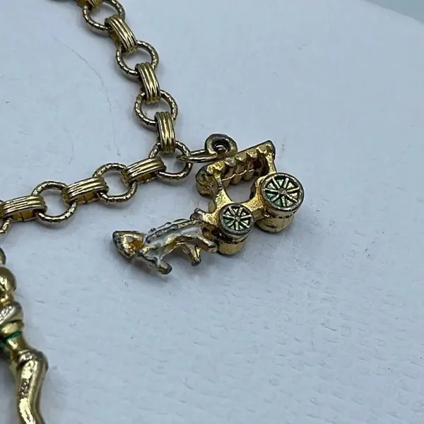Vintage 6” charm bracelet. Gold tone with crossover clasp. - Image 3