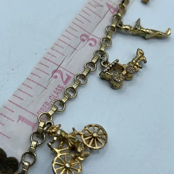 Vintage 6” charm bracelet. Gold tone with crossover clasp. - Image 8