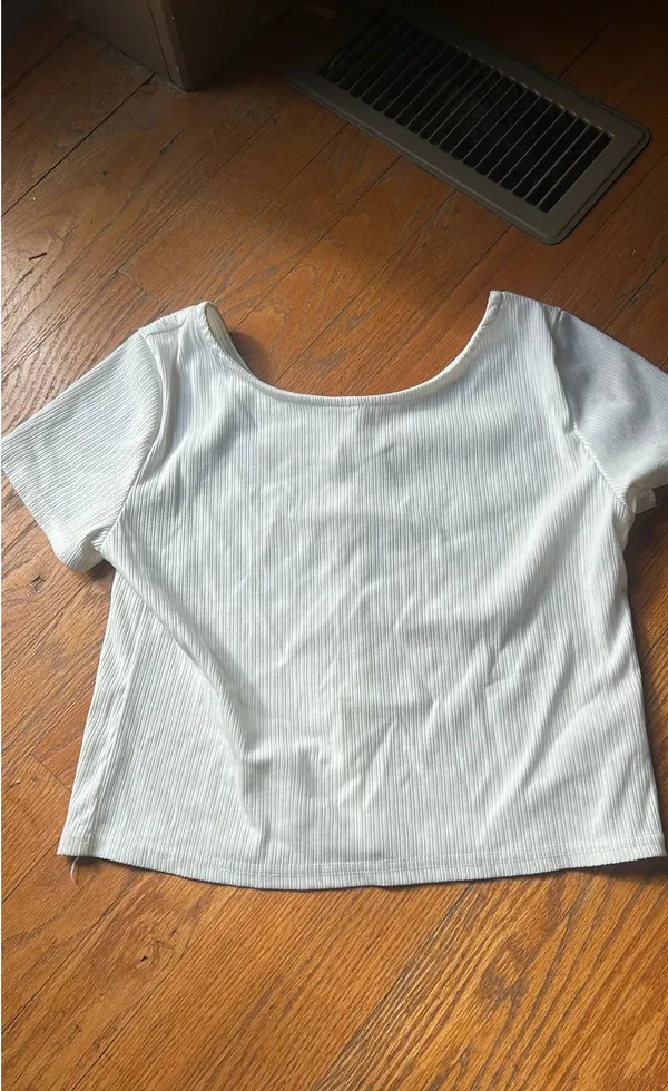 A white t with buttons going down Size M - Image 2