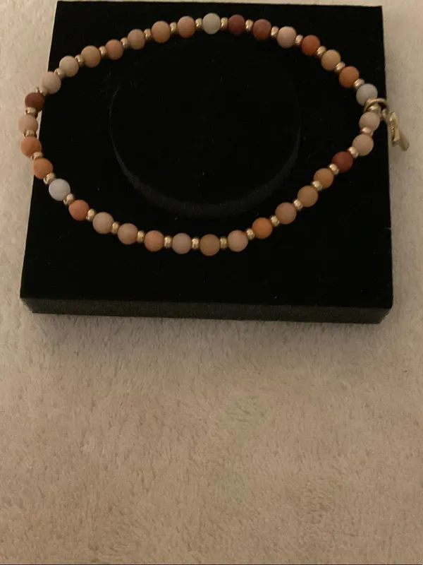 Neutral Multi-Bead Stretch Bracelet with Gold Cross Charm - Image 3