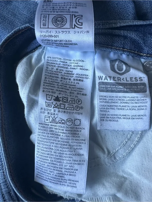 Levi’s medium-wash, high-waisted distressed straight-leg jeans - Image 2