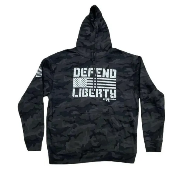 Howitzer "Defend Liberty" Black Camo Hoodie Elevate your casual wear with this rugged and patriotic Howitzer "Defend Liberty" Hoodie. Featuring a stealthy black multicam (camo) pattern, this hoodie is designed for those who value both style and a strong message of freedom. Constructed with high-quality, durable fabric, it offers a comfortable fit perfect for outdoor adventures, range days, or daily wear. Product Features: • Brand: Howitzer Manufacturing Co. • Design: Bold "DEFEND LIBERTY" distressed graphic with the American flag and an AR-15 silhouette on the front. • Back Detail: A vertical "DEFEND LIBERTY" spine graphic for a unique look from every angle. • Sleeve Detail: Features the Howitzer brand American flag patch on the sleeve. • Pattern: Modern black/dark grey camouflage. • Style: Pullover with adjustable drawstring hood and a spacious kangaroo front pocket. - Image 5