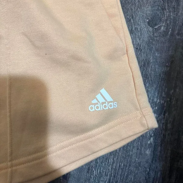 Adidas size xs high‎ waisted peach shorts with white logo - Image 2