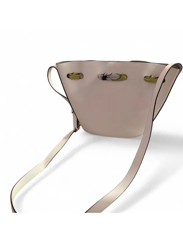 Minimal white bucket bag with removable floral scarf detail - Image 6