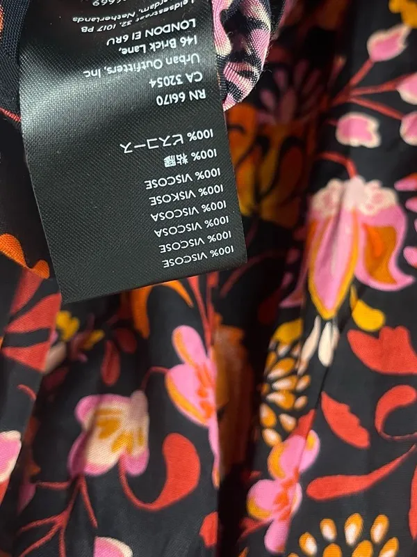 New Free People Women's Black Pixie Cross Back Floral Print Tunic Top Size large - Image 9