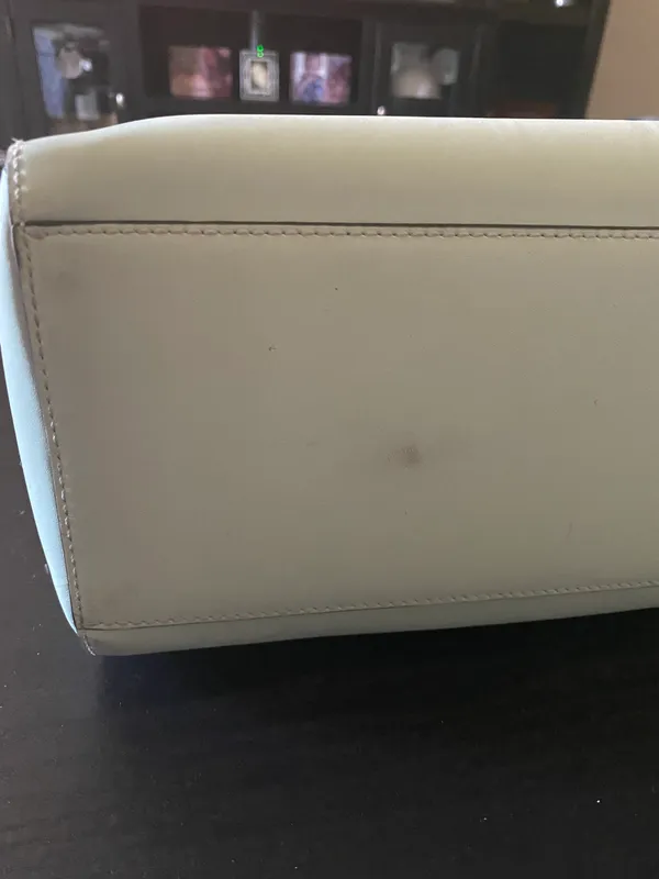 Kate Spade NEW YORK-MINT MOJITO PIPPA PARNELL STREET LEATHER SATCHEL Perfect spring bag, mint green white tan handle and crossbody strap, top zip closure, stripe print interior, inside zip pocket, inside two open pockets, amazing condition, there are two call outs, a small smudge on the bottom of the bag and a small smudge on one corner, please see the last two pictures **This bag is preowned and is being sold as is** - Image 14