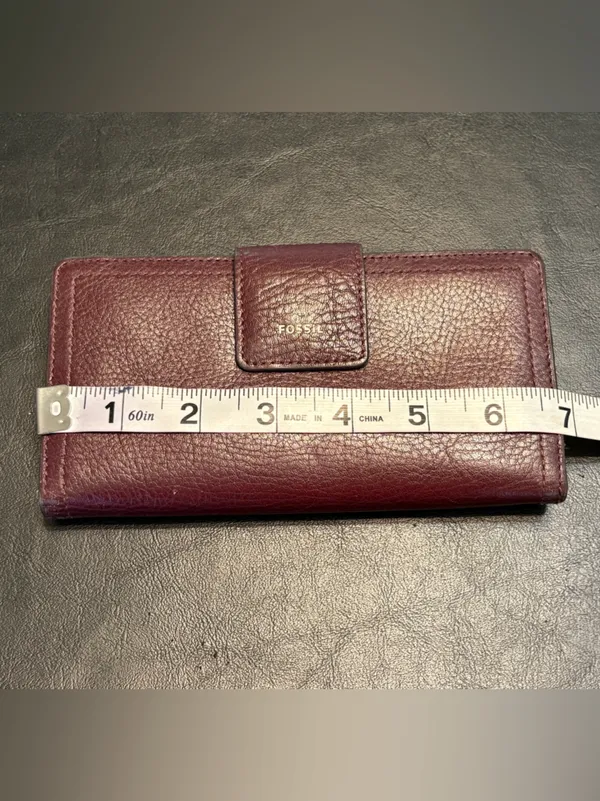 Fossil pebbled leather tab clutch wallet in a deep burgundy or berry color - Image 11