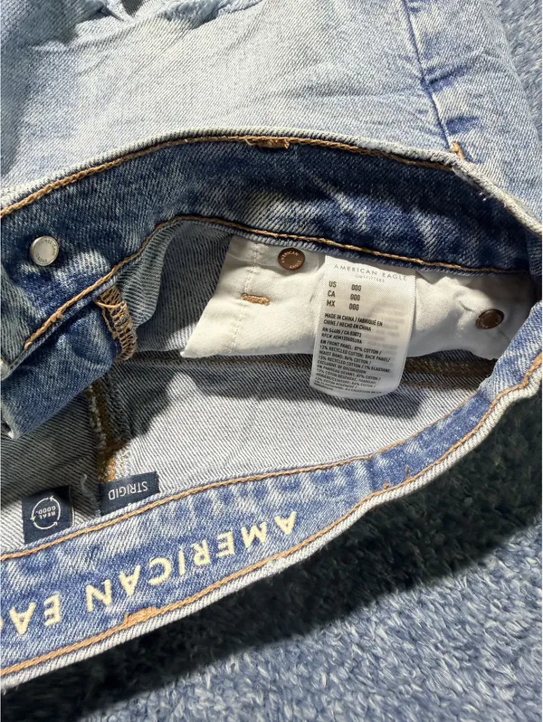 American Eagle Light Wash Distressed Denim Shorts - Image 4