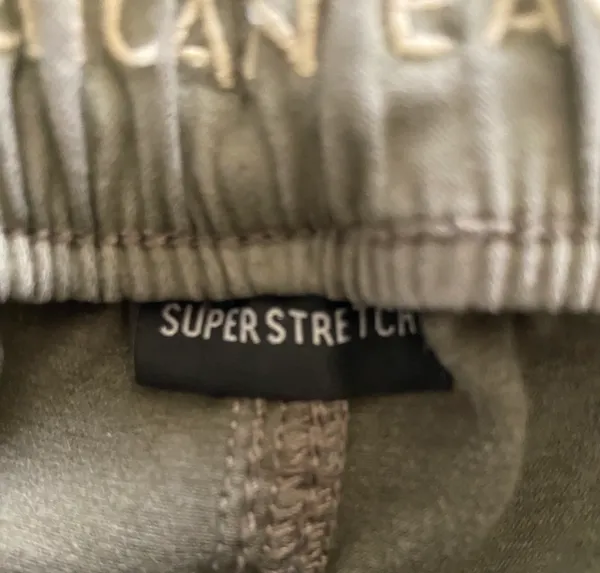 American Eagle -ARMY GREEN JOGGER PANTS-SIZE 2 Elastic waist with drawstring, zip front, two front and two back pockets, elastic ankles with a side zipper, excellent condition Measurements: Waist: side to side 13-16 inches Rise: 9 inches Inseam: 37 inches - Image 12