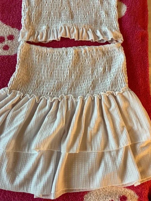 Lulus Chic white smocked two-piece set with ruffle details. Perfect for a stylish look. - Image 2