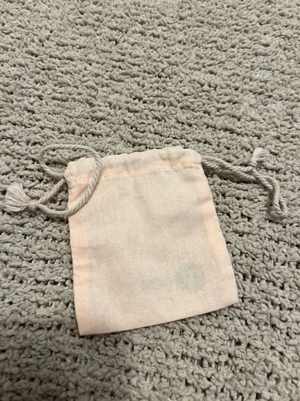 Lightweight blush pink pouch with Gorjana logo. Drawstring closure keeps contents secure. Soft fabric for small jewelry and accessories. - Image 2