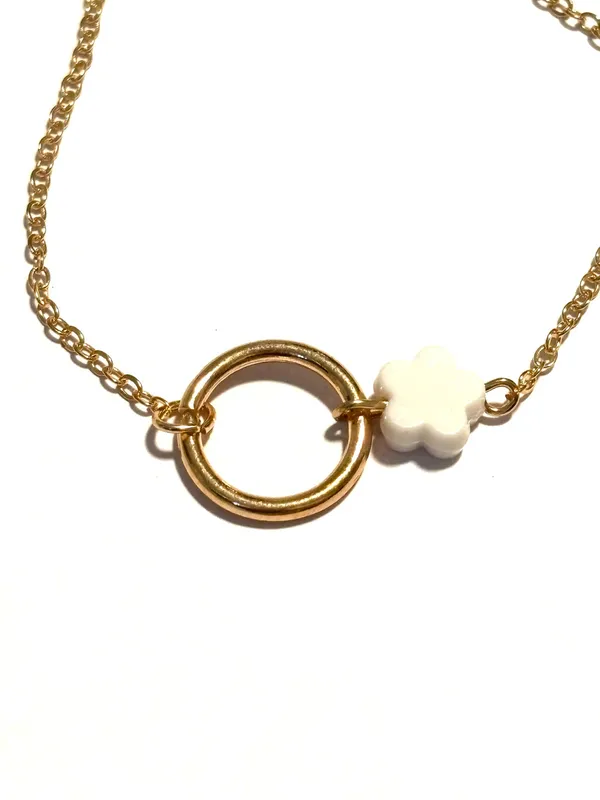Gold tone chain bracelet with flower bead and adjustable clasp - Image 2