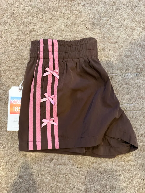 Brown athletic shorts with pink stripes and bows - Image 2
