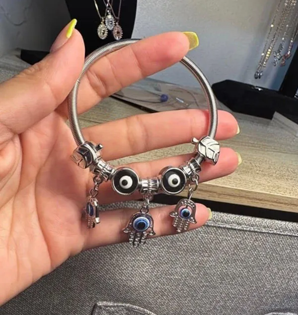 Silver bracelet with evil eye charms. - Image 2