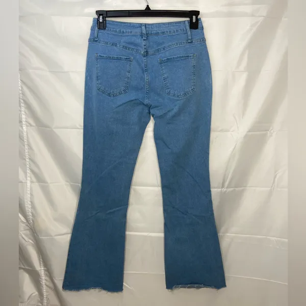 EUC Women’s medium/light wash‎ blue stretch flare leg distressed hem jeans XL - Image 4