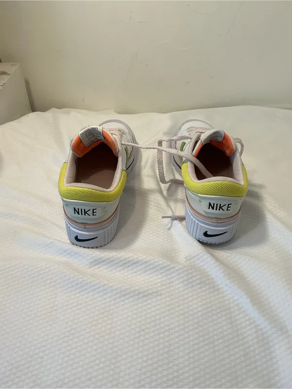 Nike White Low-Top Sneakers with Orange Tongue and Subtle Pink Lining - Image 4