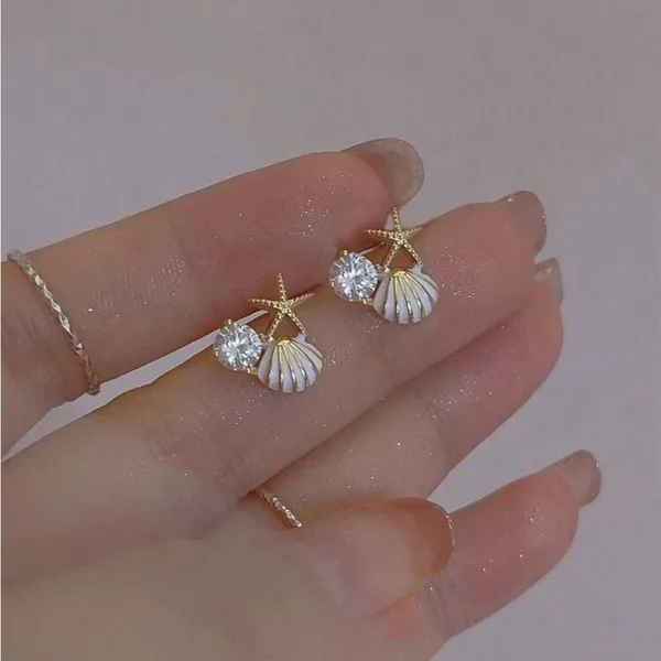 Gold and White Starfish Shell Earrings - Image 5