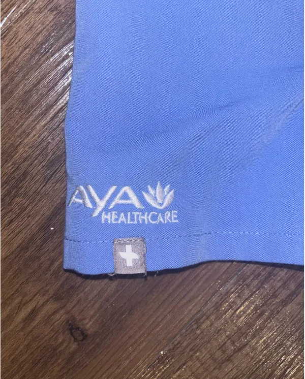 Figs women’s ceil blue scrub top with Aya Healthcare logo - Image 2