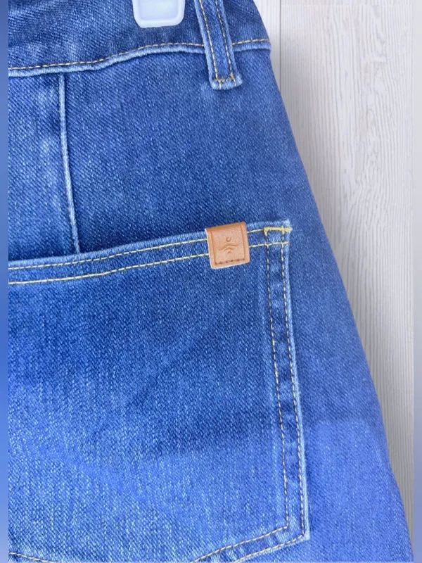 HALARA Flex High Waisted Rolled Hem Denim Look Shorts | Medium Wash - Image 6