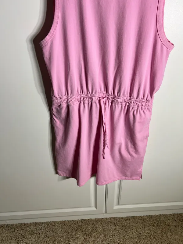 Soft pink sleeveless one-piece with an adjustable drawstring waist for a comfortable fit, with pockets. Lightweight cotton-blend fabric designed for easy movement. Simple, versatile style that pairs well with sneakers or sandals. Member’s mark size large. 57% cotton, 38% polyester, 5% spandex - Image 3