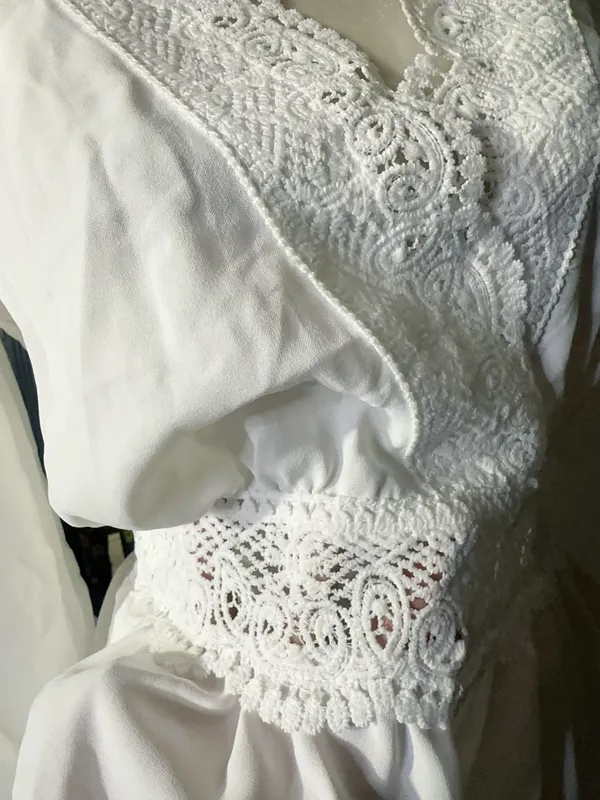 LOS ANGELES white lace V-neck long sleeve shirt top peplum tie cuff New with tag Smoke and pets free Same day shipping Elevate your wardrobe with this stunning white lace blouse from . The V-neckline and long sleeves add a touch of elegance to this top, while the peplum and tie cuff details create a flattering silhouette. The angel character and rose theme make it perfect for any occasion, from casual outings to formal events. Crafted from high-quality lace fabric, this blouse features adjustable features and is available in size S. The solid pattern and delicate lace accents make it a versatile piece that can be paired with any bottom. Whether you're dressing up or down, this Rose & Grey blouse is sure to turn heads. - Image 7