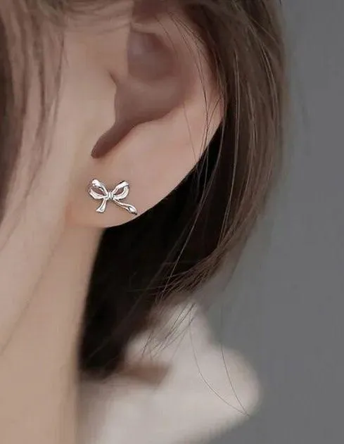 Boutique Silver Bow Stud Earrings - Image 2