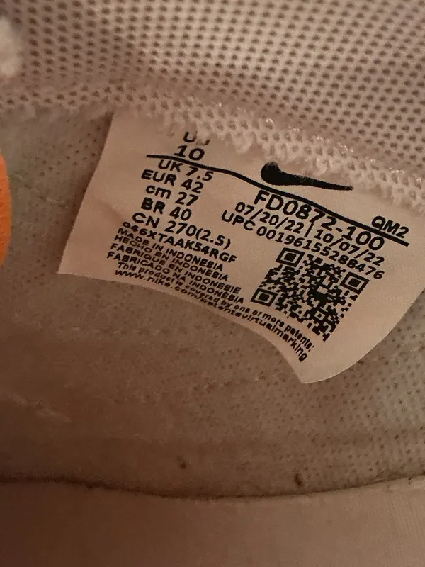 Nike White Low-Top Sneakers with Orange Tongue and Subtle Pink Lining - Image 2