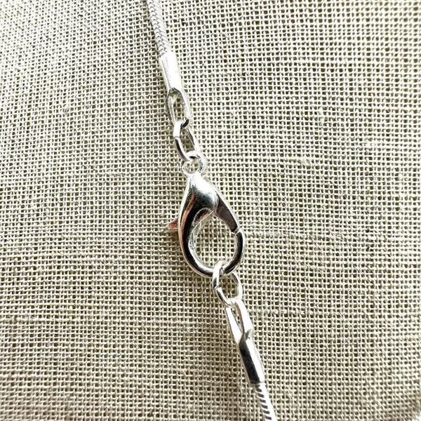 Silver tone rhinestone cross necklace - Image 6