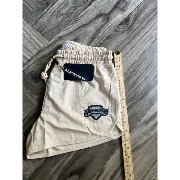 NEW Alphalete Woman’s Varsity Short - Tan ,size Medium - Image 8
