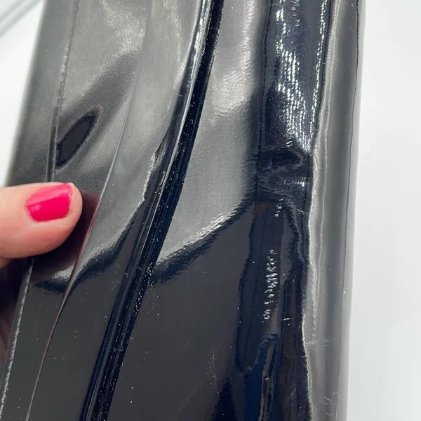 Black faux patent leather clutch with wave design on front. - Image 5