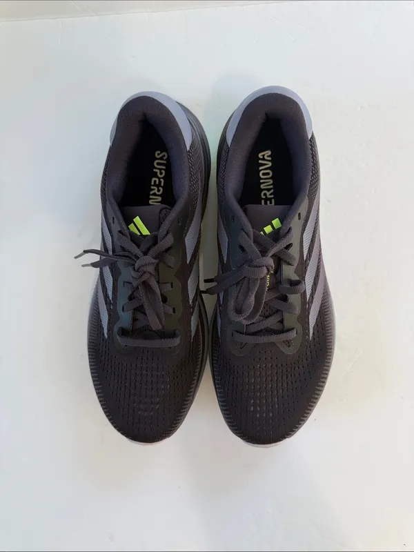 adidas women’s Black Athletic Shoes with White Stripes and Neon Green Accent - Image 3
