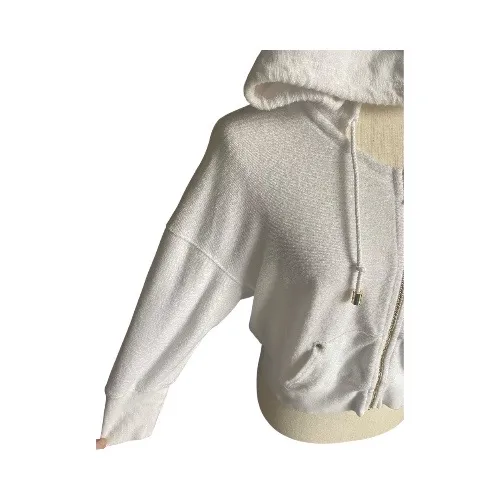 JUICY COUTURE-WHITE ZIP FRONT HOODIE-WOMENS SIZE SMALL Cozy white hooded zip-up jacket with drawstrings. Perfect for casual wear, 3/4 sleeves, gold hardware, J zipper pull, 100% cotton, has stretch, excellent condition Measurements: Bust: armpit to armpit 23-25 inches Length: shoulder seam to bottom 20 inches - Image 2