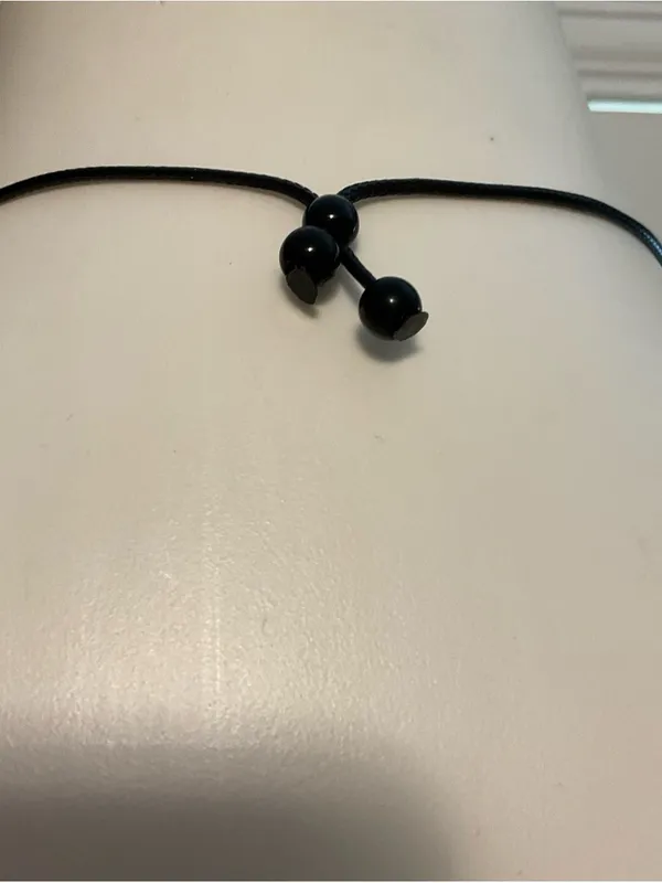 Elegant Black Cord Necklace with Ring Pendant - Image 4