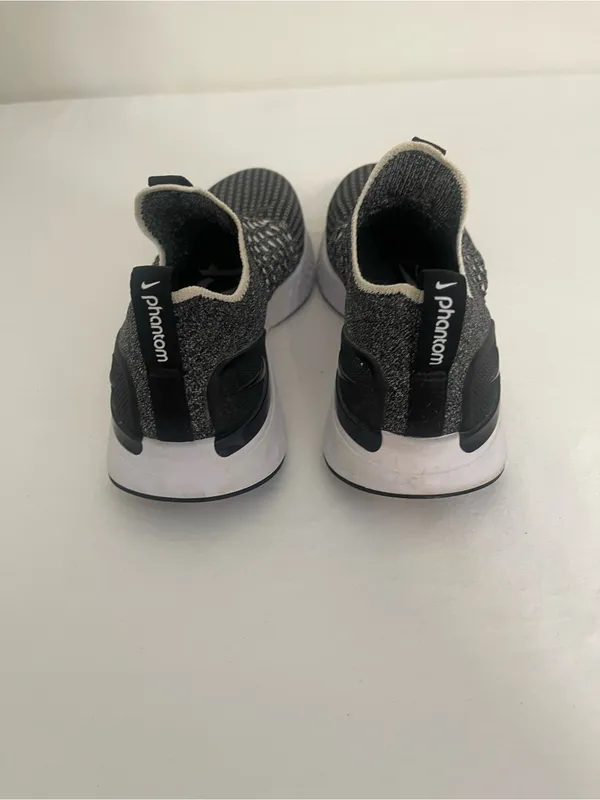 Nike Women’s Black and White Slip-On Knit Sneakers - Image 6