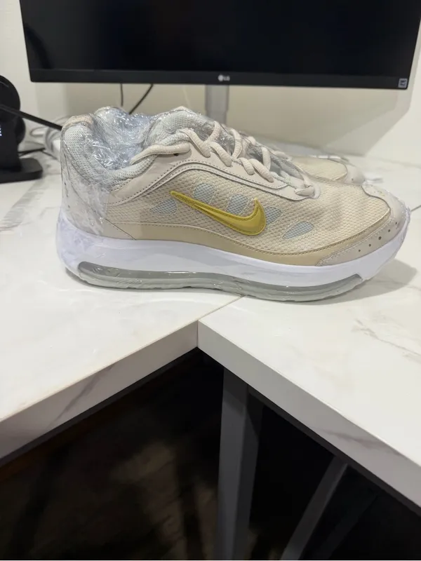 Nike Beige Athletic Sneakers with Gold Swoosh - Image 5